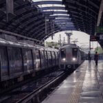 A metro train arriving at an elevated station platform